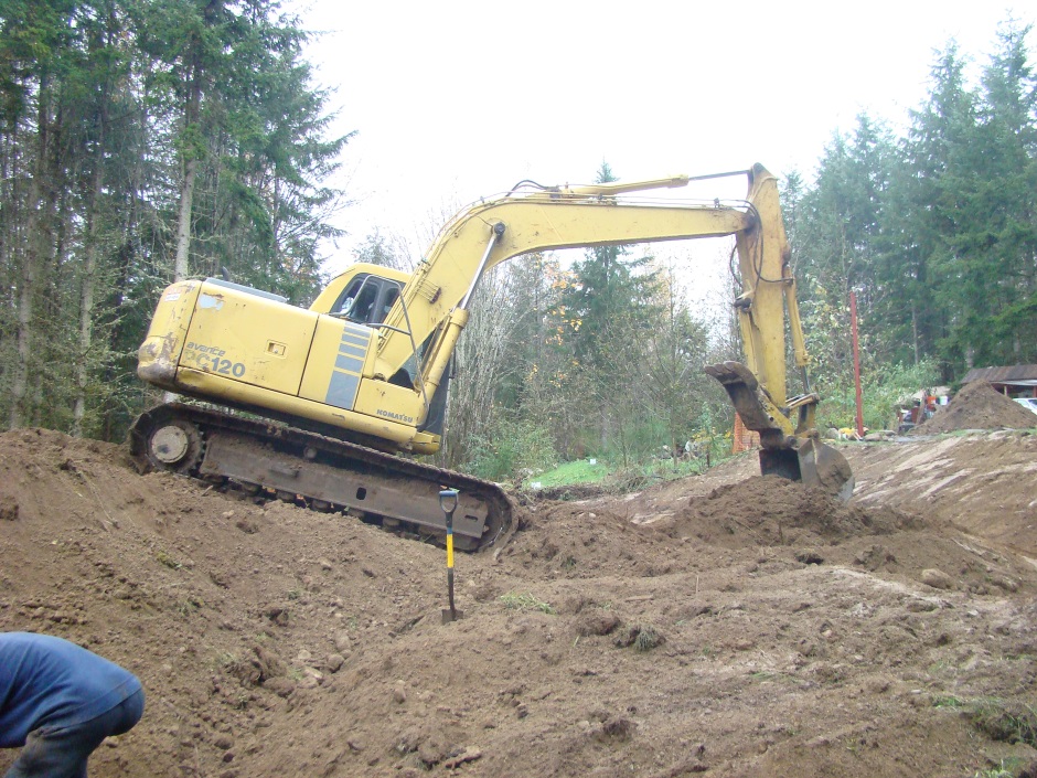 Excavator digging slope