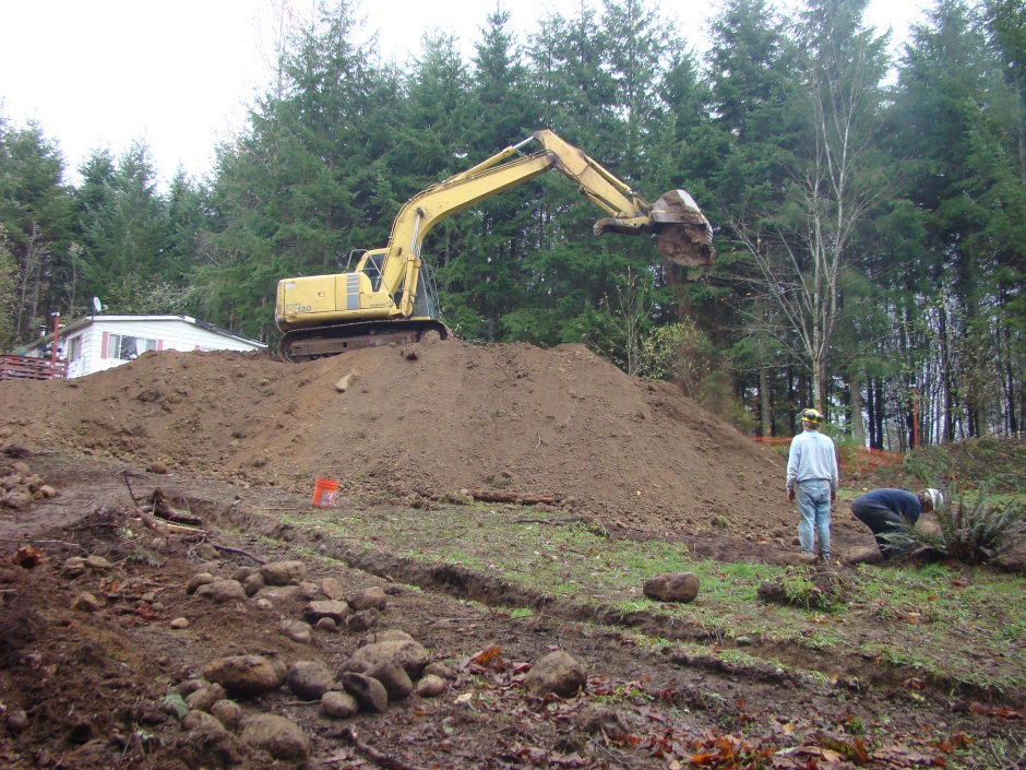 Excavator dropping soil