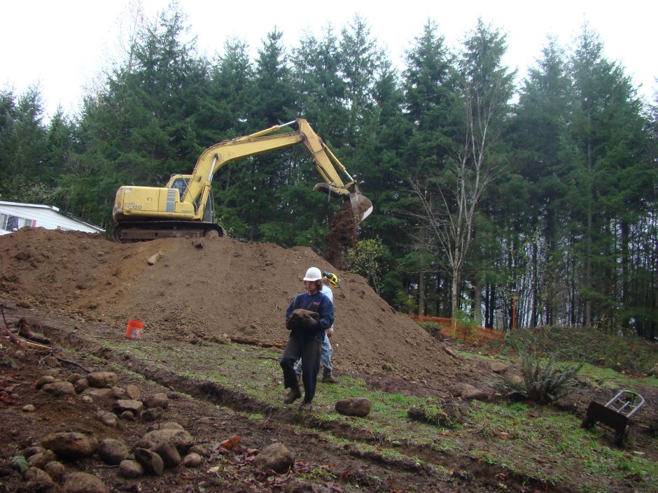 Excavator carrying rock