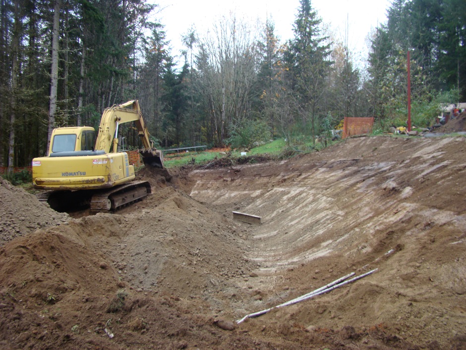Excavator digging in slope
