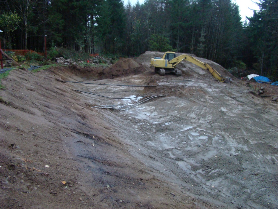 Excavator resting showing pipes