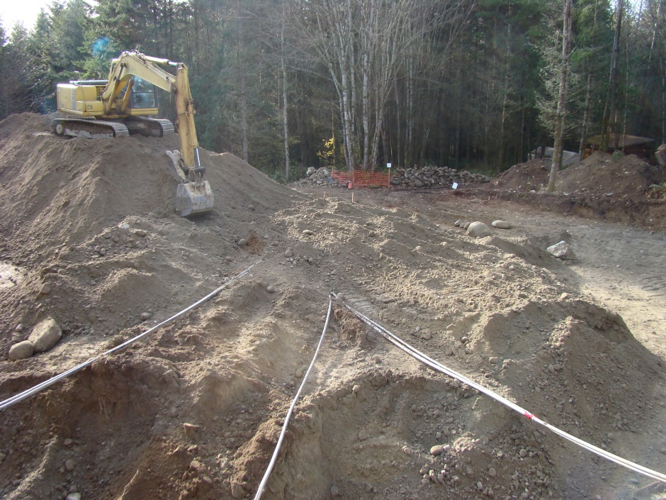 Excavator digging mound