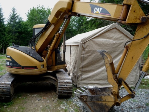 Digger by car port