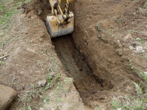 Digging drainage ditch