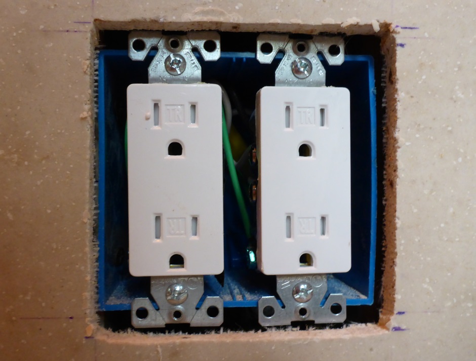 Drywall fits over electrical outlets