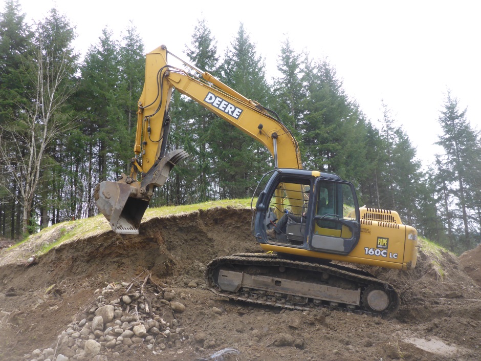 Moving Mountain Edge With Excavator