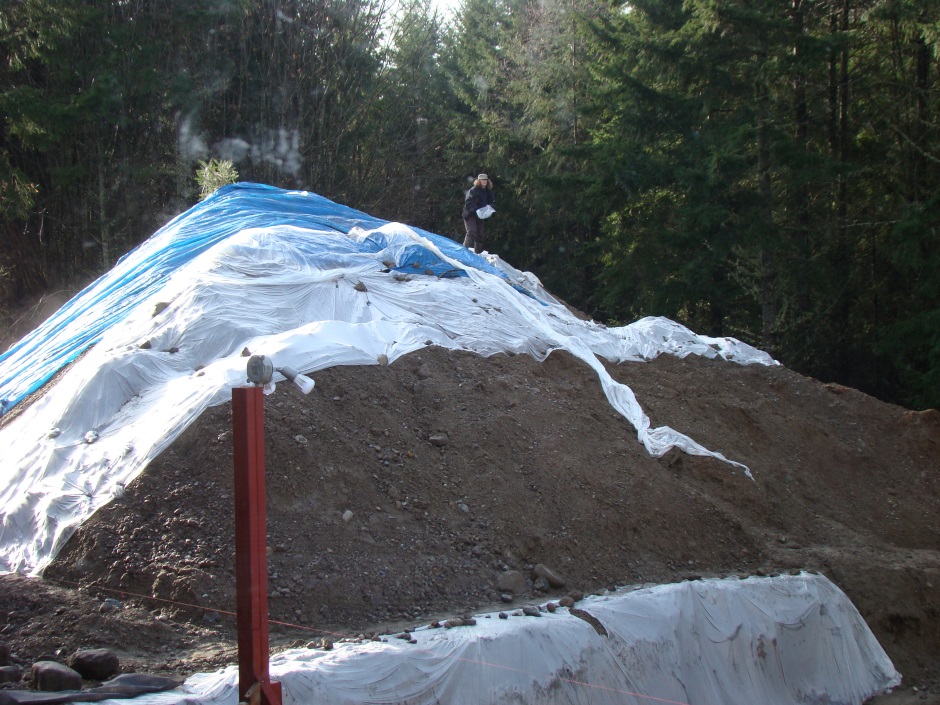 Plastic over earth mound