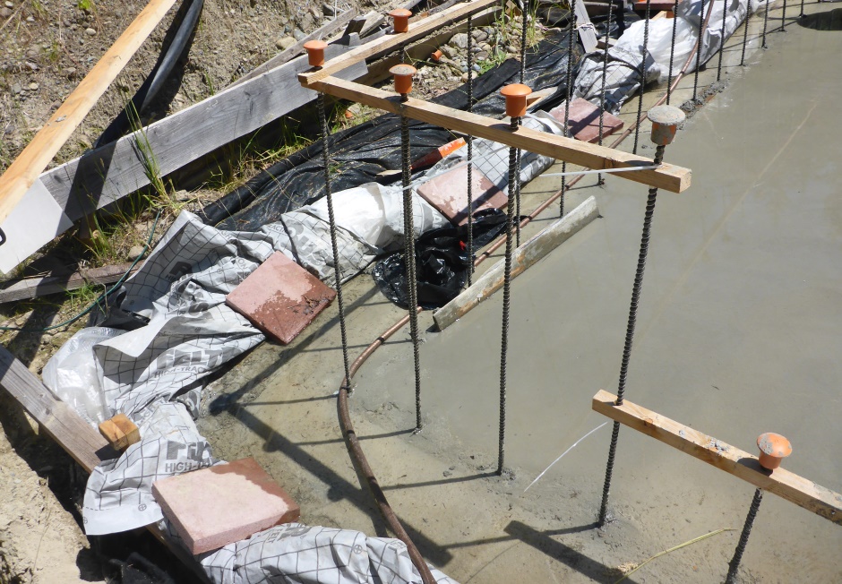 Polyethylene Sheet Rolled Up At Slab Edges