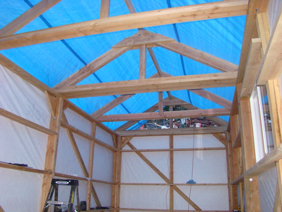 Shed inside roof trusses