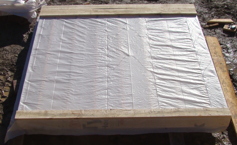 Shed polyethylene sheet over floor
