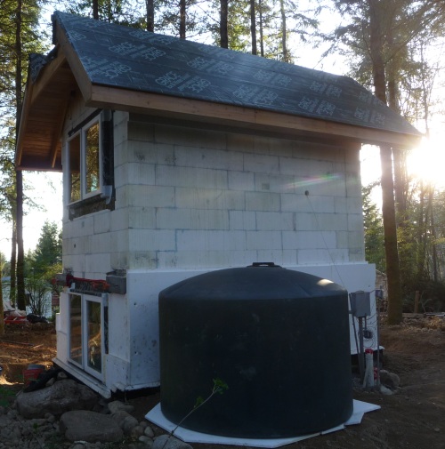 Site with backfill and water tank