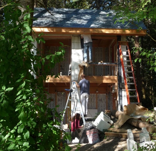 Three working on large window frame