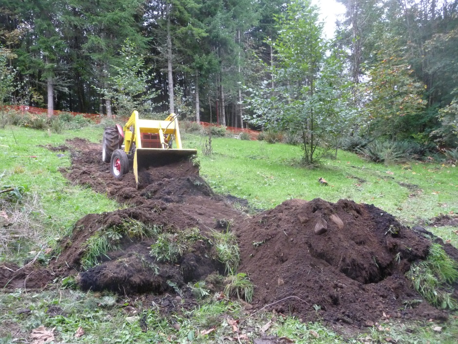 Top soil removal with tractor